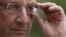 France's President Francois Hollande adjusts his glasses after a meeting at the Elysee Palace in Paris, September 20, 2012.
