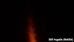 The <em>SpaceX Falcon 9</em> rocket launches with the Double Asteroid Redirection Test, or DART, spacecraft onboard, from Space Launch Complex 4E at Vandenberg Space Force Base in California.