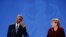 U.S. President Barack Obama gestures during a joint news conference with German Chancellor Angela Merkel in Berlin.