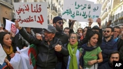 Demonstrators rally to denounce President Abdelaziz Bouteflika's bid for a fifth term, in Algiers, Algeria, Feb. 24, 2019.