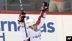 Washington Capitals left wing Alex Ovechkin (8) celebrates his 700th career goal during the third period of an NHL hockey game against the New Jersey Devils, Feb. 22, 2020, in Newark, New Jersey. 