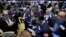 Traders gather at a post on the floor of the New York Stock Exchange, Feb. 26, 2016. 