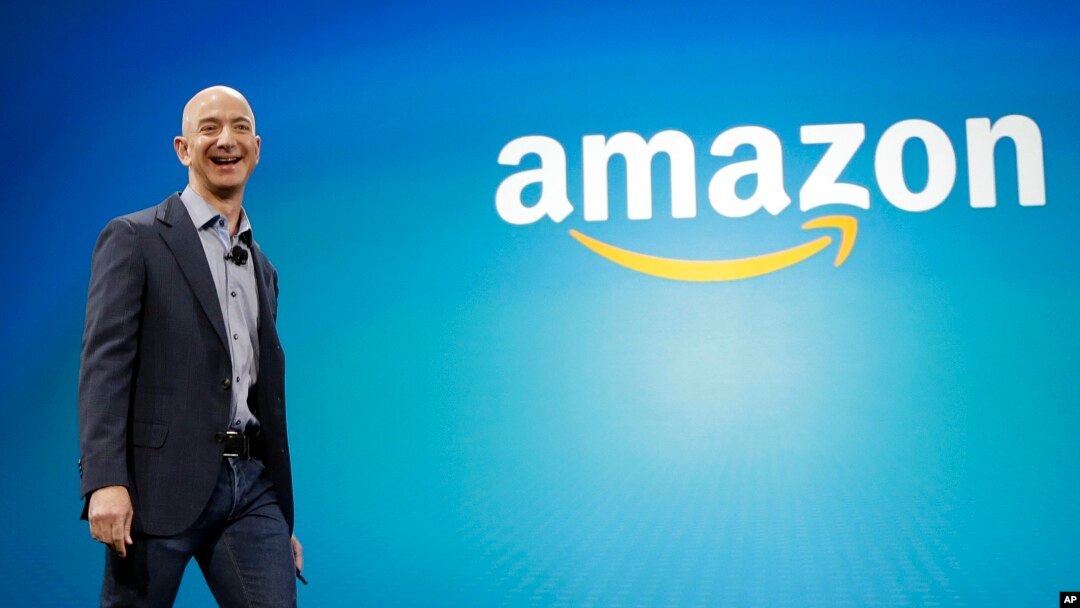 FILE - Amazon CEO Jeff Bezos walks onstage for the launch of the new Amazon Fire Phone, in Seattle. 