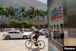 Traffic moves past Miami's Adrienne Arsht Performing Arts Center the day before 20 Democratic U.S. presidential candidates begin a two night debate that will be the first debate of the 2020 U.S. presidential election in Miami.