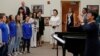 U.S. first lady Melania Trump and China's first lady Peng Liyuan listen as students perform for them during a visit to Bak Middle School of the Arts in West Palm Beach, Florida, April 7, 2017.
