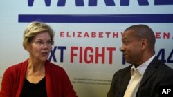 Democratic presidential contender and U.S. Senator Elizabeth Warren speaks with state Senator Marlon Kimpson during a campaign stop in Charleston, South Carolina, Oct. 9, 2019.