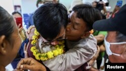 FILE - Natthaporn Onkaew, 26, embraces his father, Thawatchai Onkaew, 47, as he arrives back home after being held for nearly two months when he was taken hostage by the Palestinian Islamist group Hamas in Gaza, in Nakhon Phanom, Thailand, December 1, 2023