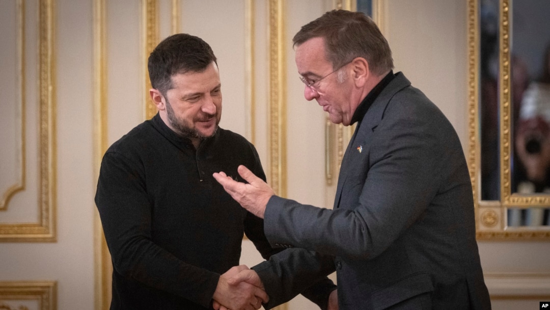 Ukrainian President Volodymyr Zelenskyy, left, welcomes visiting German Defense Minister Boris Pistorius in Kyiv, Ukraine, Jan. 14, 2025.