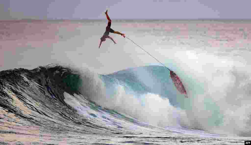 Surfer Nathan Florence wipes out during practice at Sunset Beach in Pupukea, Oahu, Hawaii, Dec. 29, 2020.