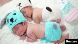 Newborn babies wearing dog styled clothing to celebrate the New Year of the Dog are pictured at the Paolo Chokchai 4 Hospital in Bangkok, Thailand on December 28, 2017. (REUTERS/Athit Perawongmetha/File Photo)