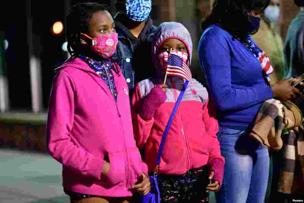 A family gathers at a watch party before U.S. President-elect Joe Biden delivers a victory speech, in Wilmington, Delaware, Nov. 7, 2020. 