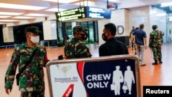 Indonesian soldiers are seen at Soekarno-Hatta International Airport after Sriwijaya Air plane flight SJ182 with more than 50 people on board lost contact after taking off, according to local media, in Tangerang, near Jakarta, Indonesia, Jan. 9, 2021.