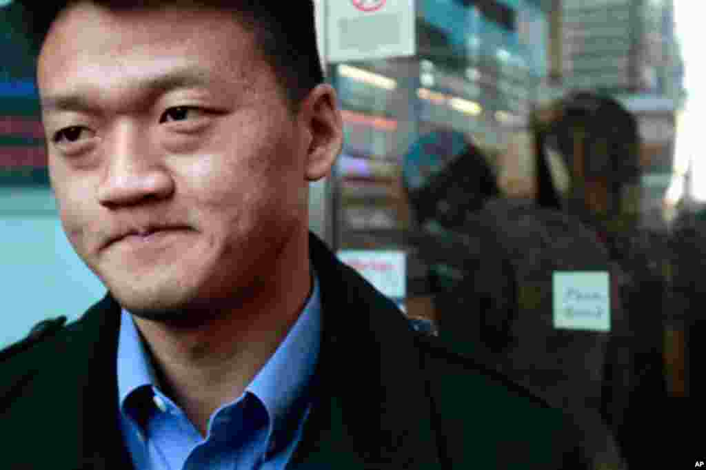 Dan Choi, an Iraq War veteran and a West Point graduate who was discharged from the military in July because he announced publicly that he is gay, reacts as he waits to enter the U.S. Armed Forces Recruiting Center in Times Square, hoping to re-enlist on