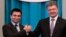 Ukrainian President Petro Poroshenko (R) congratulates new Ukrainian Foreign Minister Pavel Klimkin in Kyiv, June 19, 2014.
