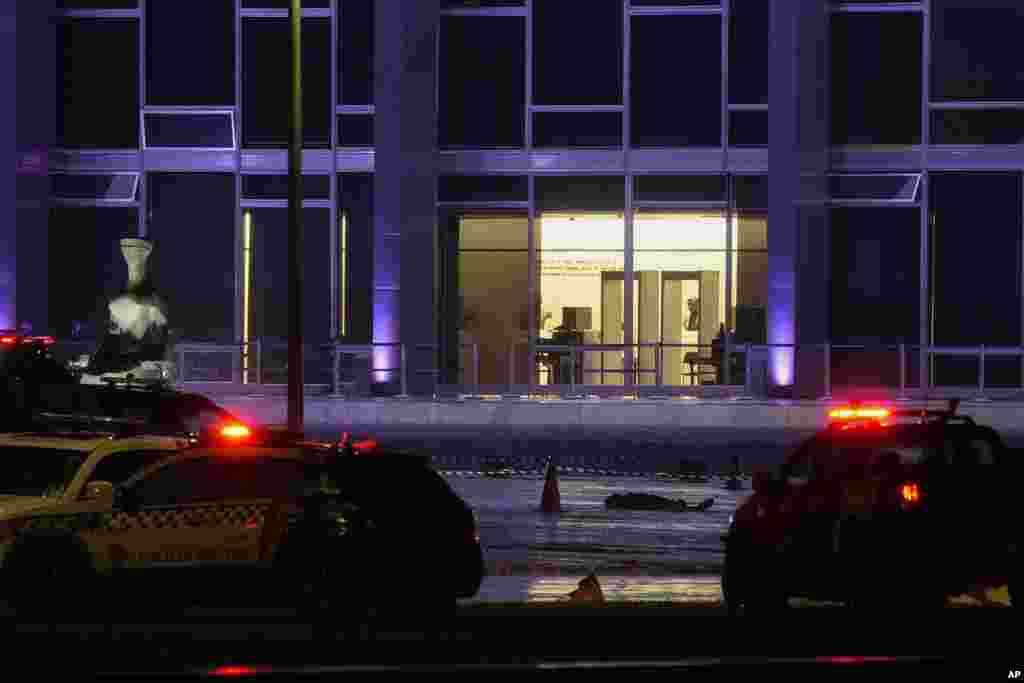 A body lies outside the Supreme Court in Brasília, Brazil, following an explosion, Nov. 13, 2024. 