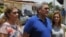 FILE - Former general Raul Baduel (C) talks to the media next to his wife Cruz Maria de Baduel (L) and his daughter, in front of their house in Maracay, Venezuela, Aug. 13, 2015. 