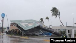 An advertising structure felled by wind is pictured in a street as Hurricane Nora barrels towards southwest coast of Mexico, in Manzanillo, in Colima state, Mexico, Aug. 28, 2021.