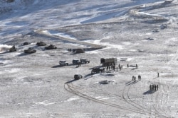 This handout photograph released by the Indian Army on Feb. 16, 2021 shows People Liberation Army (PLA) soldiers and tanks during military disengagement along the Line of Actual Control at the border in Ladakh. (Indian Defense Ministry/AFP)