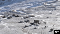 This undated handout photograph released by the Indian Army on Feb. 16, 2021 shows People Liberation Army (PLA) soldiers and tanks during military disengagement along the Line of Actual Control (LAC) at border in Ladakh. (Indian Defense Ministry/AFP)