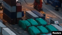 Six of nine armored troop carriers, which belong to Singapore, detained at a container terminal in Hong Kong, Nov. 24, 2016.