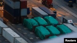 Six of nine armored troop carriers, which belong to Singapore, detained at a container terminal in Hong Kong, Nov. 24, 2016.