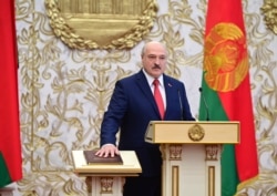 FILE - Belarusian President Alexander Lukashenko takes his oath of office during his inauguration ceremony at the Palace of the Independence in Minsk, Belarus, Sept. 23, 2020.