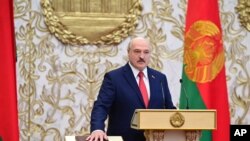 FILE - Belarusian President Alexander Lukashenko takes his oath of office during his inauguration ceremony at the Palace of the Independence in Minsk, Belarus, Sept. 23, 2020. 