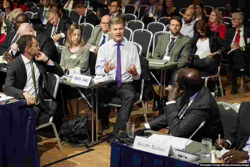 A delegate at the South Sudan donor conference in Oslo, Norway, addresses South Sudan Foreign Minister Barnaba Marial Benjamin.