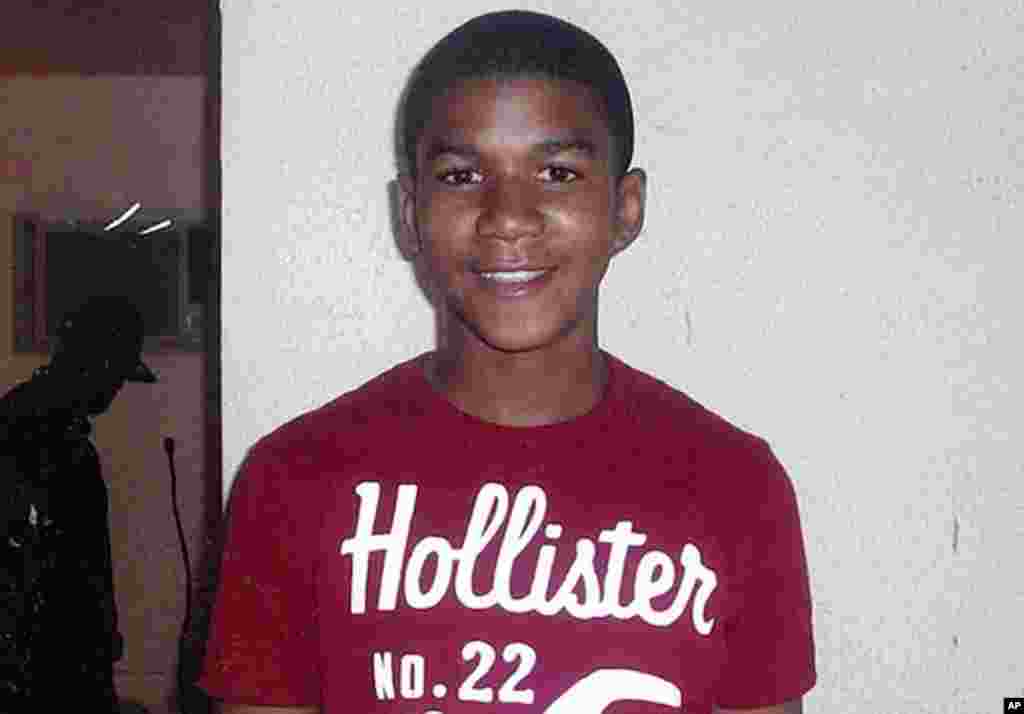 FILE - This undated file family photo shows Trayvon Martin. The Sanford police department released a video Thursday, March 29, 2012, showing George Zimmerman being escorted into the Sanford police station in handcuffs on Feb. 26, 2012, the night he fatall