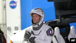 FILE - European Space Agency astronaut Thomas Pesquet of France talks to family and friends before a launch attempt at the Kennedy Space Center in Cape Canaveral, Florida, April 23, 2021.