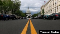 FILE - The US Capitol dome is pictured ahead of a vote on the additional funding for the coronavirus stimulus economic relief plan, amid the coronavirus disease (COVID-19) outbreak in Washington, April 21, 2020.