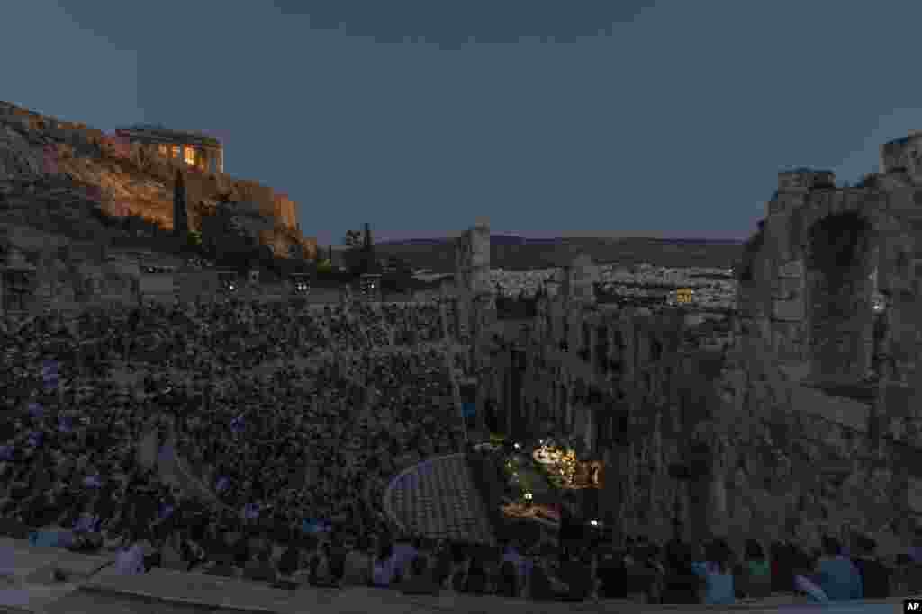 Actors and singers perform at the Odeon of Herodes Atticus in Athens, Greece, after the site was reopened for performances, July 15, 2020.