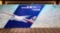 A board written with messages for passengers onboard the missing Malaysia Airlines Flight MH370 is seen at Lido Hotel in Beijing, China, May 2, 2014.