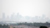 Haze hangs in the air over downtown Denver, July 24, 2024. Fires burning in western states, as well as Canada, have filled the skies with smoke and haze, forcing some affected areas to declare air quality alerts or advisories. 