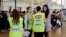 British Embassy staff assist in the evacuation of tourists at the Sharm el-Sheikh International Airport, south Sinai, Egypt, Nov. 6, 2015.