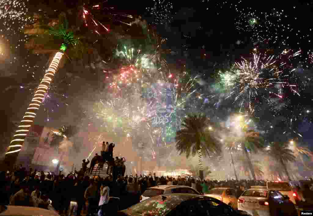 Fireworks explode during New Year celebrations in Baghdad, Iraq, Jan. 1, 2025. 