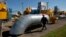 A gas pipeline station worker passing the gas pressure engines in Bil 'che-Volicko-Ugerske underground gas storage facilities in Strij, outside Lviv, Ukraine, May 21, 2014. 