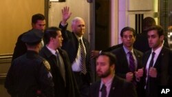 Vice President-elect Mike Pence (top center) leaves the Richard Rodgers Theatre after a performance of "Hamilton" in New York, Nov. 18, 2016. 