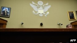 Acting Director of National Intelligence Joseph Maguire, right, testifies before a hearing of the House Permanent Select Committee on Intelligence in Washington.