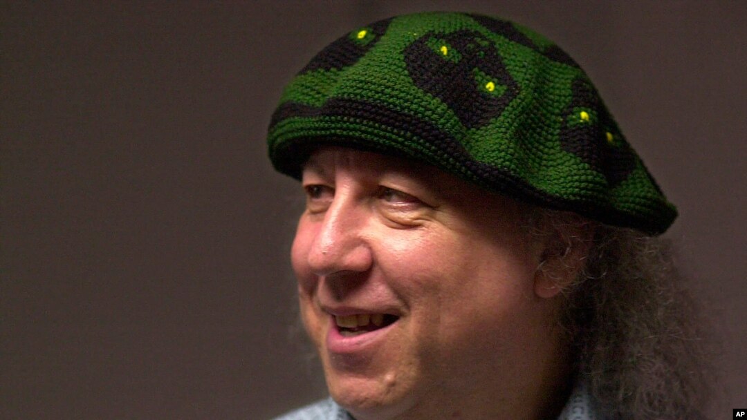 FILE - British rock and blues guitarist Peter Green, a founding member of Fleetwood Mac, backstage before performing with his own band, Peter Green's Splinter Group, at B.B. King Blues Club & Grill, in New York, April 7, 2001.