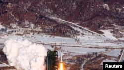 A video grab from KCNA shows the Unha-3 (Milky Way 3) rocket launching at North Korea's West Sea Satellite Launch Site, at the satellite control center in Cholsan county, North Pyongan province, Dec. 13, 2012.