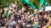 Brazil's President Jair Bolsonaro reacts during a meeting with supporters protesting in his favor, amid the coronavirus disease (COVID-19) outbreak.