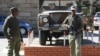 FILE - Army personnel are seen outside the military headquarters in Maseru, Lesotho.