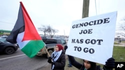 FILE - Pro-Palestinian demonstrators march during a visit by President Joe Biden in Warren, Mich., Feb. 1, 2024.