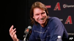 Former major league pitcher Randy Johnson speaks with reporters in Phoenix after being selected to enter the National Baseball Hall of Fame, Jan. 6, 2015.