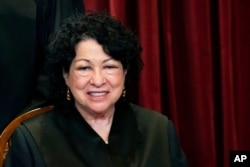 FILE - Associate Justice Sonia Sotomayor sits during a group photo at the Supreme Court in Washington, April 23, 2021.