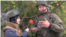 Oleg Nitkin, official representative of the Donestk People’s Militia, showing a reporter from the Russian Defense Ministry's TV Zvezda the remnant from a mortar shell allegedly used by Ukrainian forces in the country's east.
