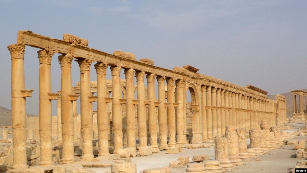 FILE - The demolition of ancient monuments like this colonnade in the historical city of Palmyra, Syria was targeted by the Islamic State group and among cultural sites destroyed in 2015. 