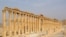 FILE - The demolition of ancient monuments like this colonnade in the historical city of Palmyra, Syria was targeted by the Islamic State group and among cultural sites destroyed in 2015. 
