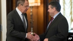 Russian Foreign Minister Sergey Lavrov, left, shakes hands with German counterpart Sigmar Gabriel in Moscow, Russia, March 9, 2017.